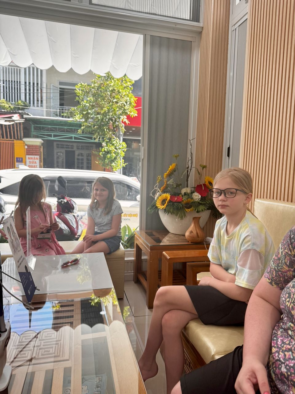 Three girls waiting at a dental clinic in Da Nang