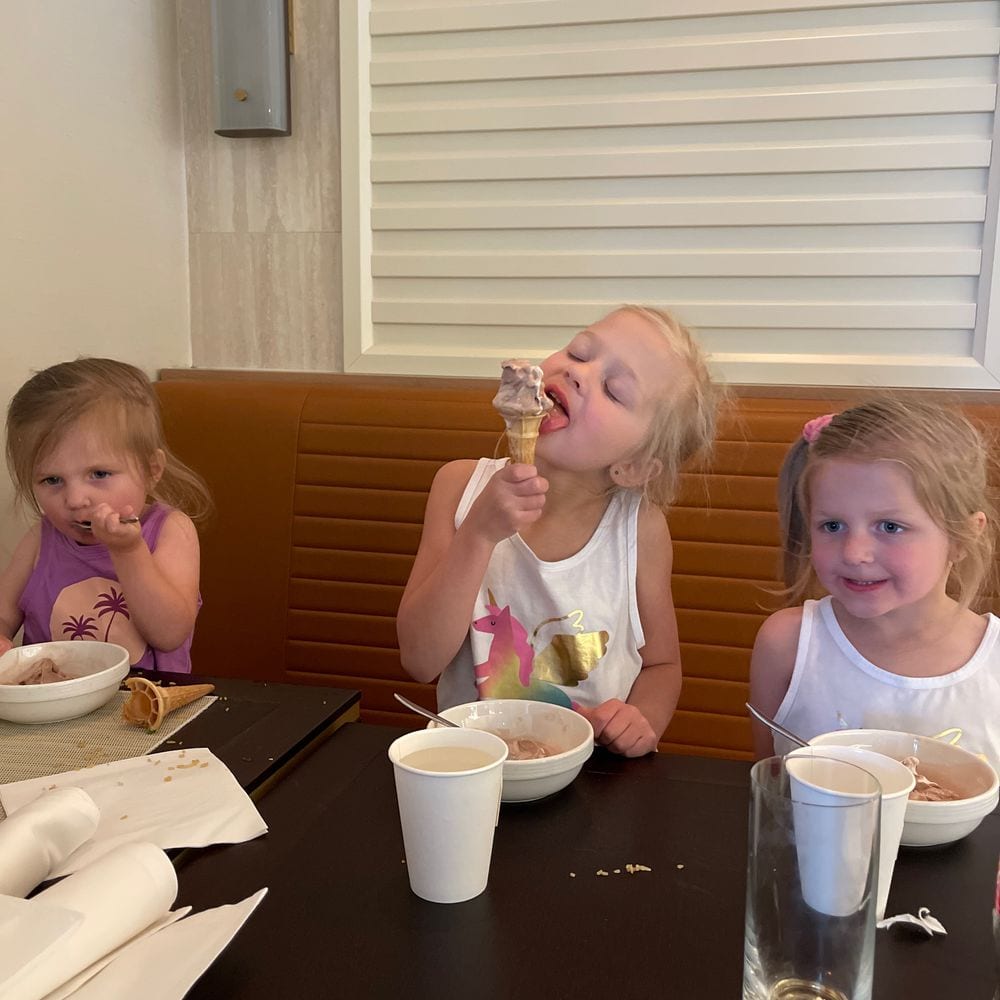 Lily, Cora, and Harper with ice cream cones after dinner at the Queen Mary 2 buffet
