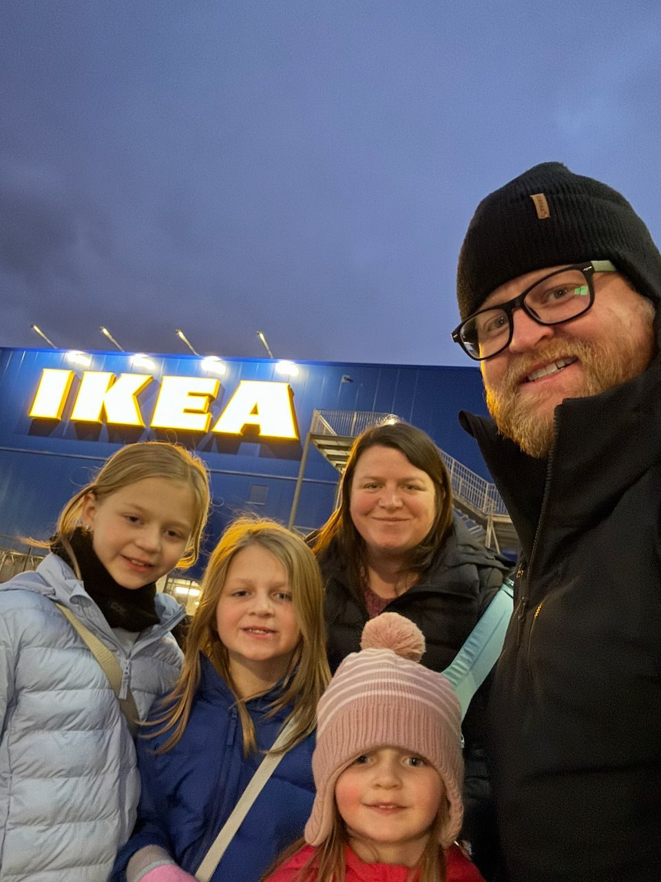 The Clarkson family taking a selfie at an IKEA store in Malmö, Sweden at dusk